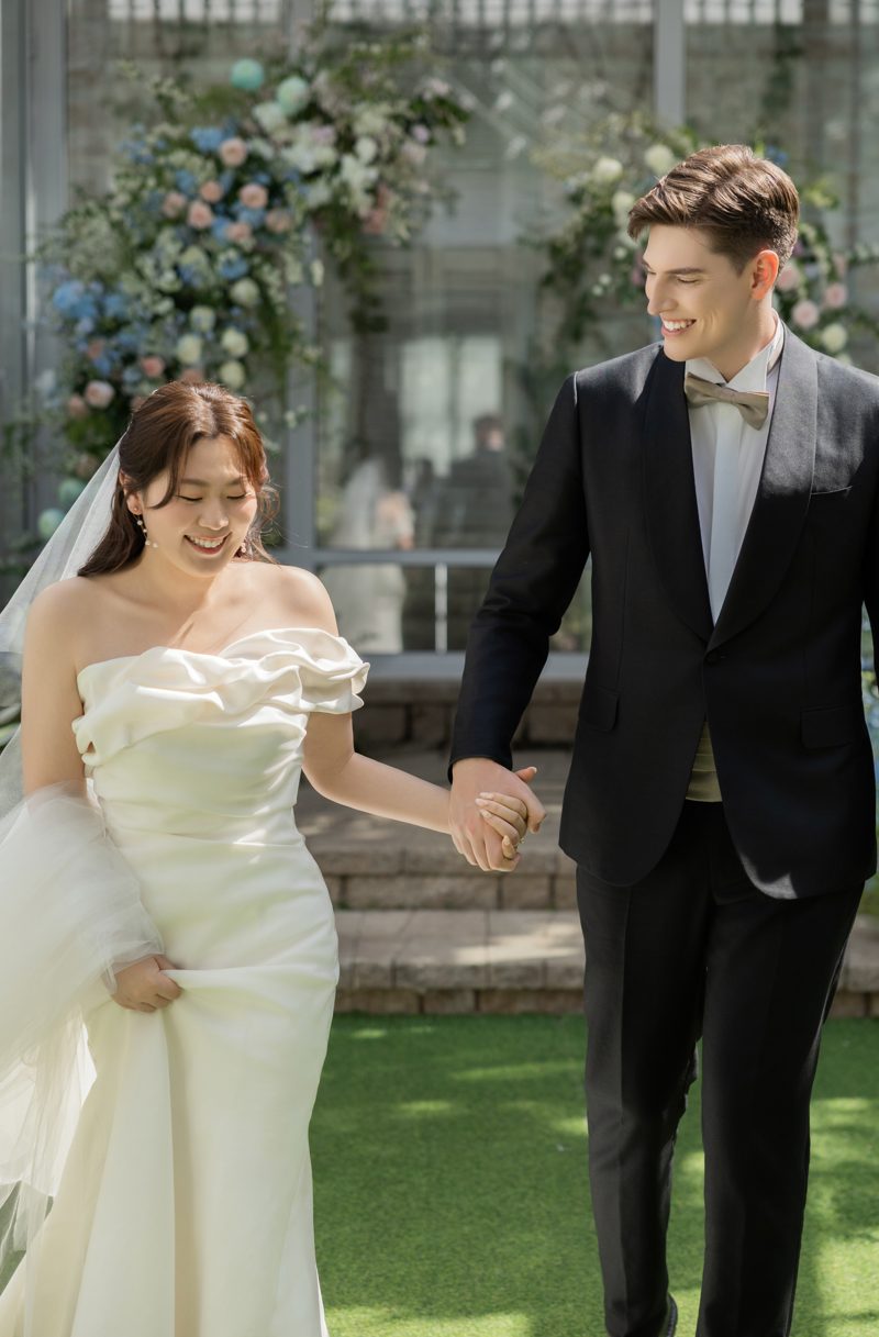 Leah and Nathan walking hand in hand
